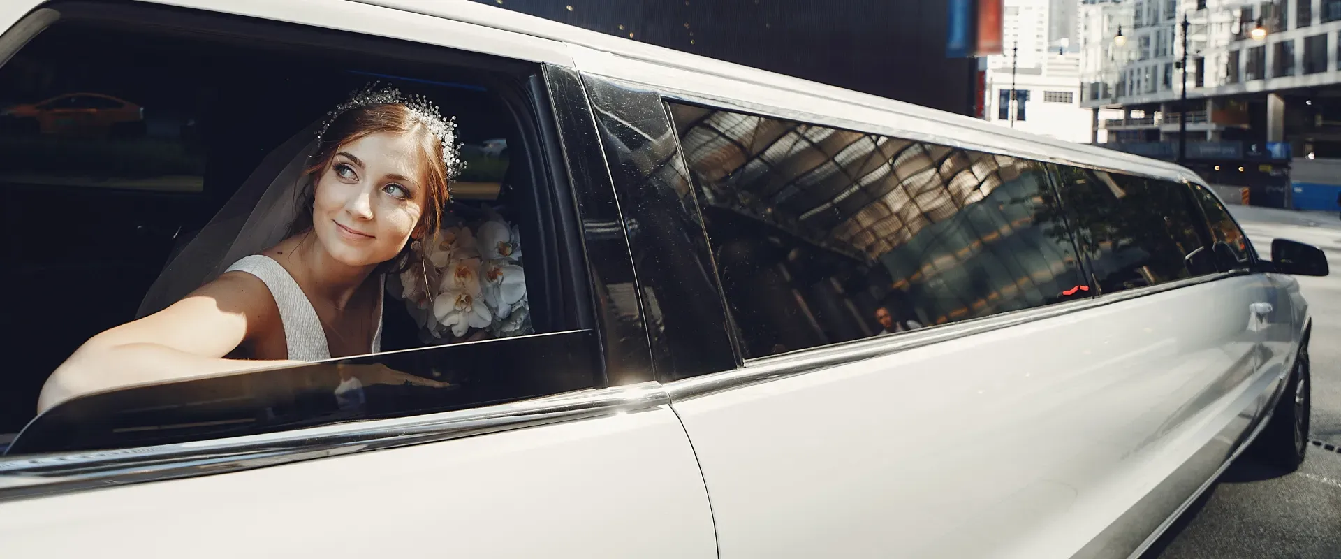 A bride stepping into a white stretch limousine A bride stepping into a white stretch limousine